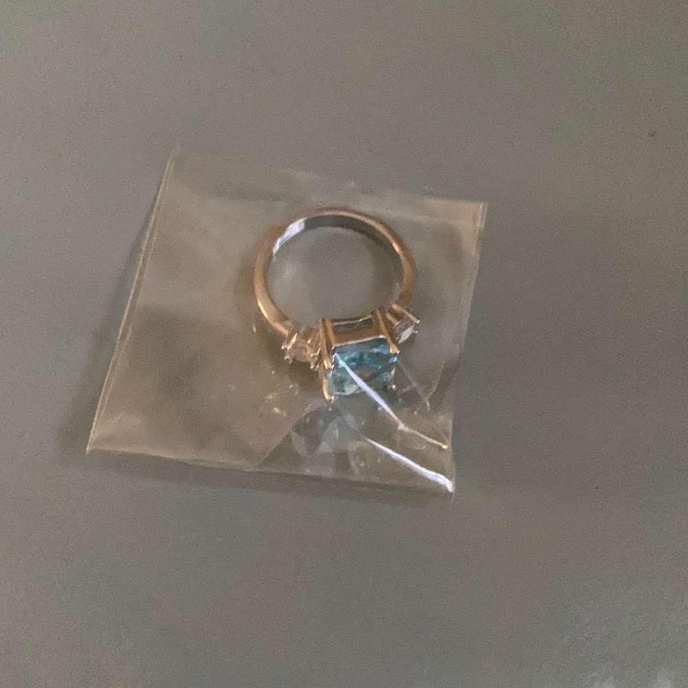 Lt turquoise ring. Costume jewelry. Not positive about size, 5 or 6.